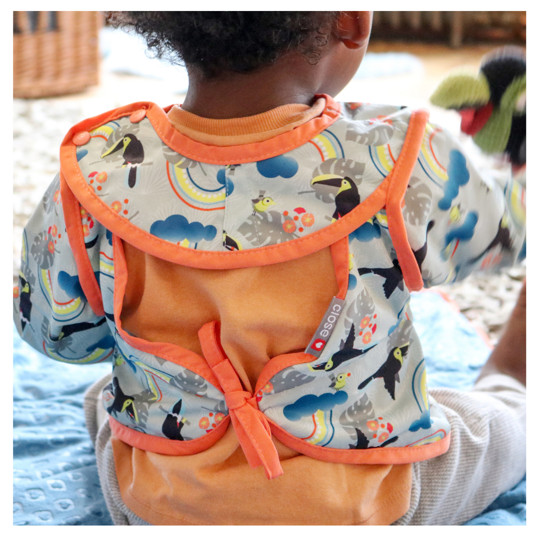 Things get messy with a little one, and sometimes a standard bib isn’t quite enough. This clever coverall bib takes the protection up a notch, making it perfect for mealtime, crafts, outdoor play, painting, play dough and much more.